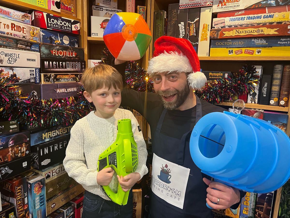 Jon Drew of The Board Room Gaming Café with six-year-old Charlie