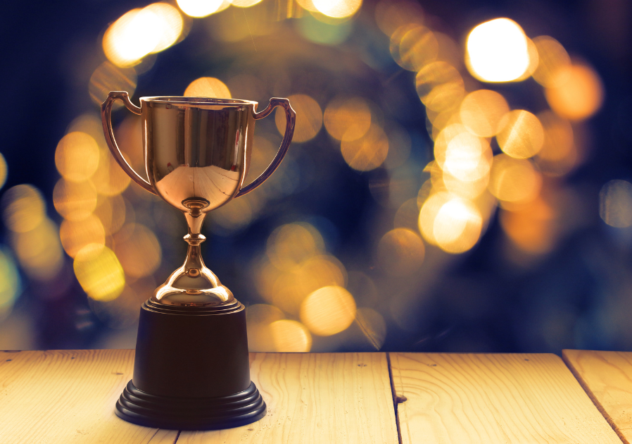 trophy on a table with twinkly lights